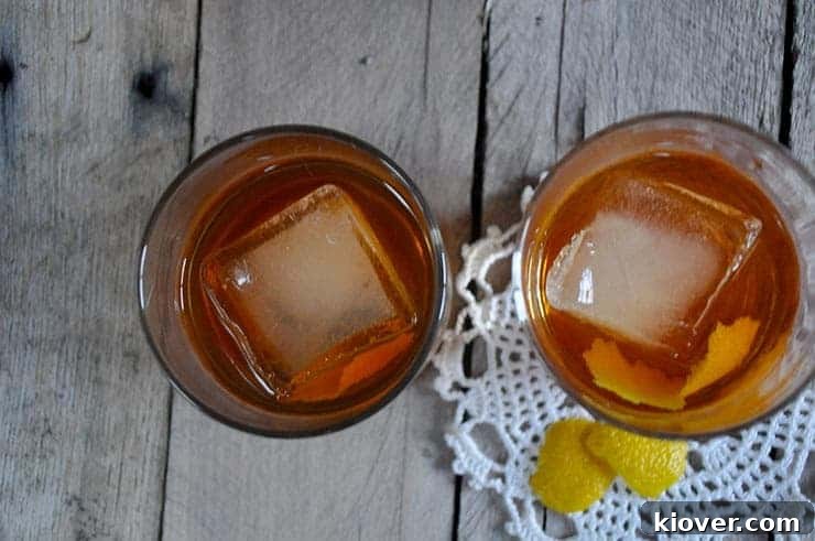 old fashioned from a top view, showcasing the lemon peel garnish and large ice cube