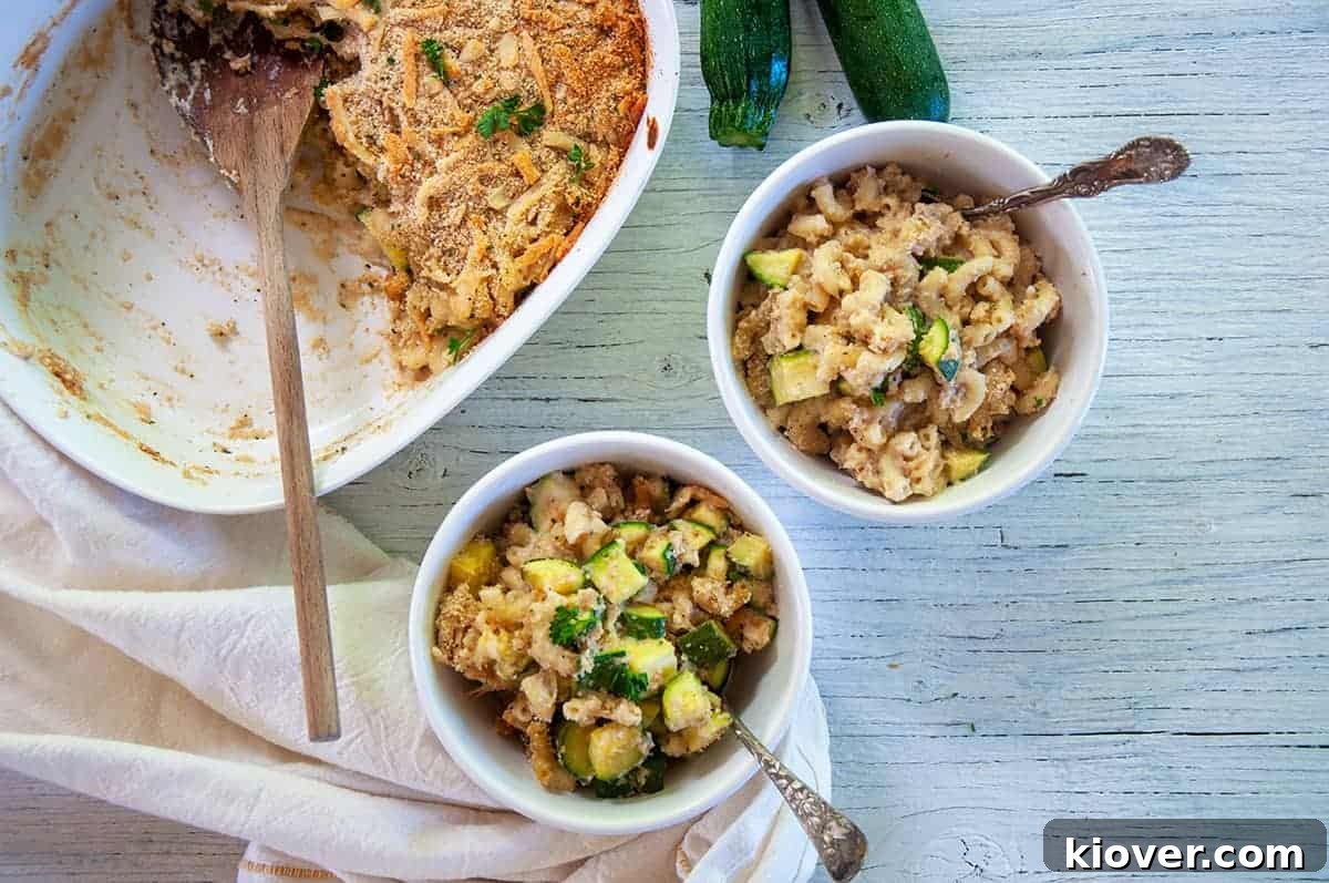 Overhead picture of two bowls of Italian Zucchini Casserole and a casserole dish that has some removed.