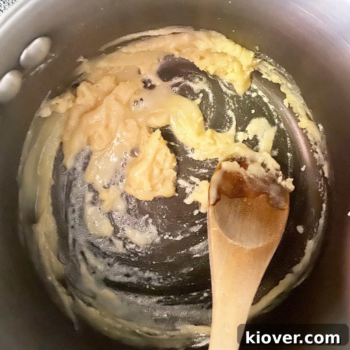 Effortless Creamy Homemade Queso 2 Pan with butter and flour in it being made into a roux before adding milk to thicken.
