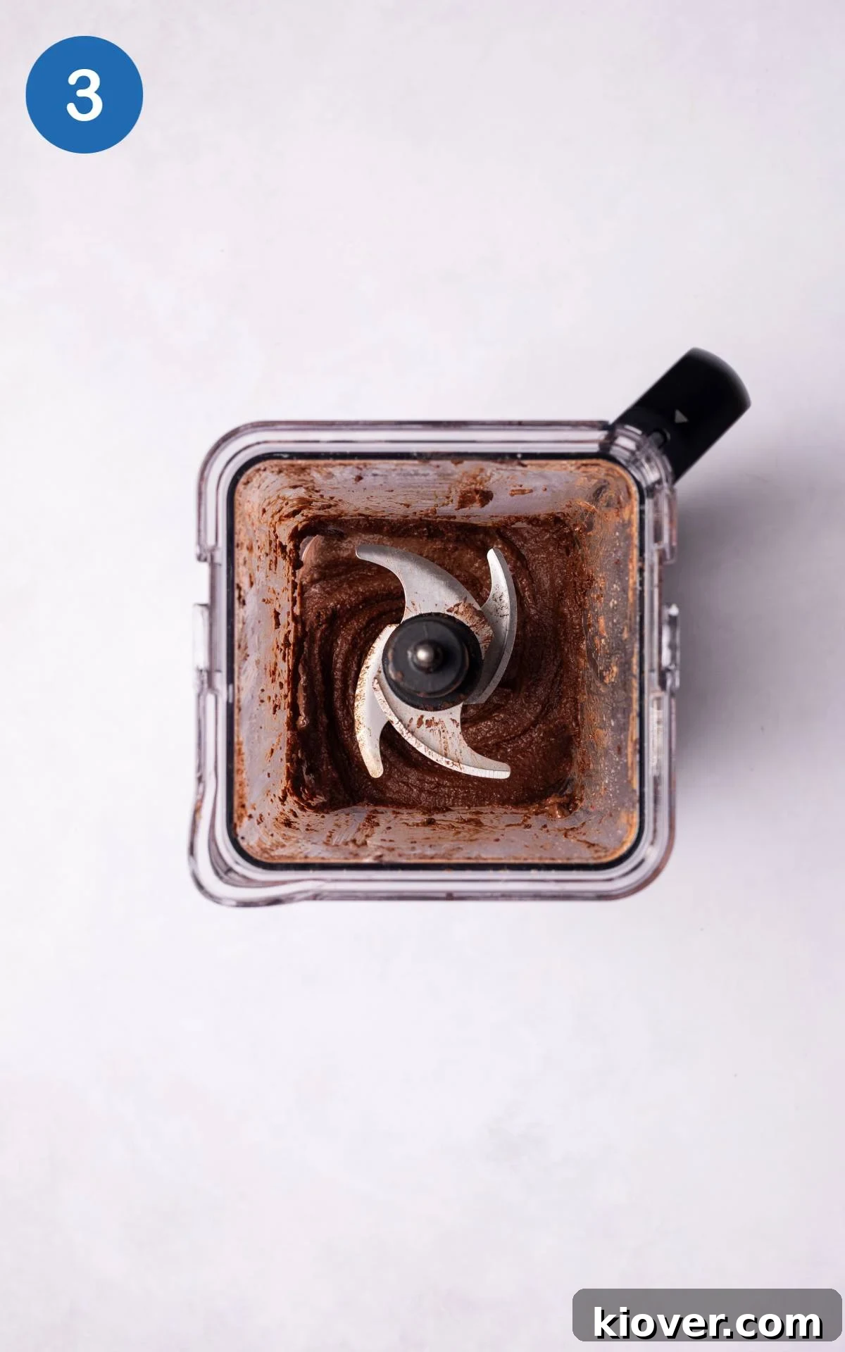 All ingredients, including blended hazelnuts, water, cacao powder, and maple syrup, combined in a food processor.