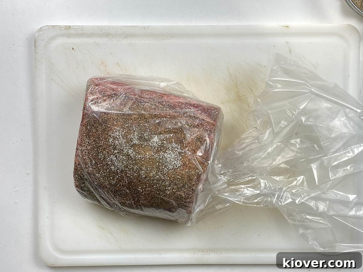 Bagged Prime Rib A seasoned prime rib roast securely sealed within a bag, poised and ready to be gently submerged into the sous vide water bath for precise cooking.