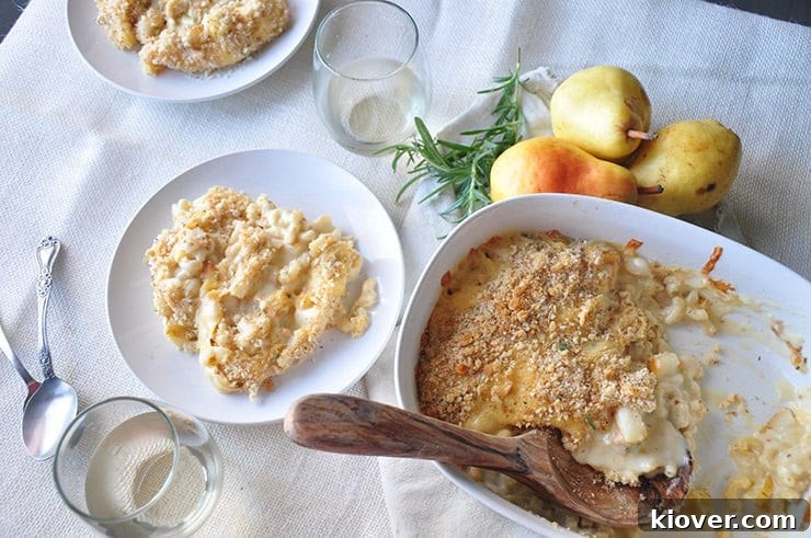 Overhead shot of Pear and Gouda Macaroni and Cheese in a baking dish, freshly scooped