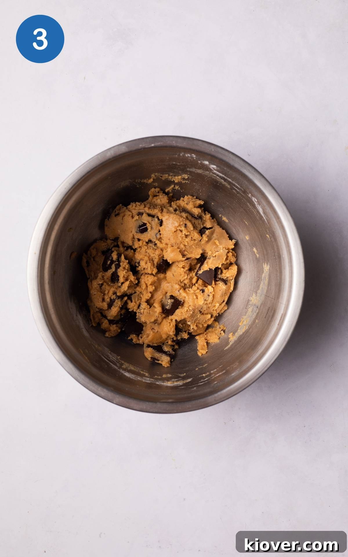 Chewy Vegan Peanut Butter Cookies Recipe 6 adding flour and chocolate to the mixture.