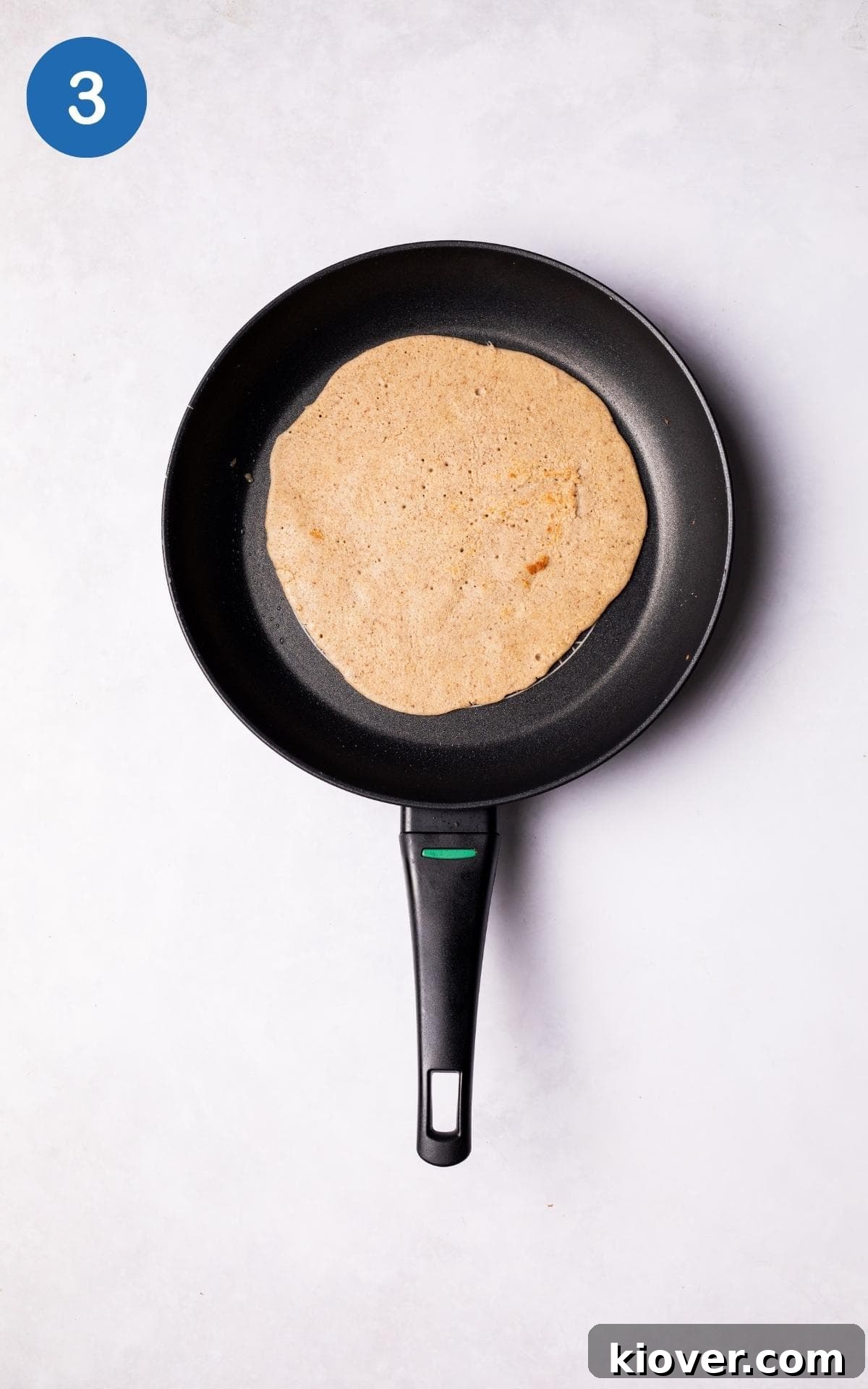 Lightly brown Gluten Free Crepe in a pan.