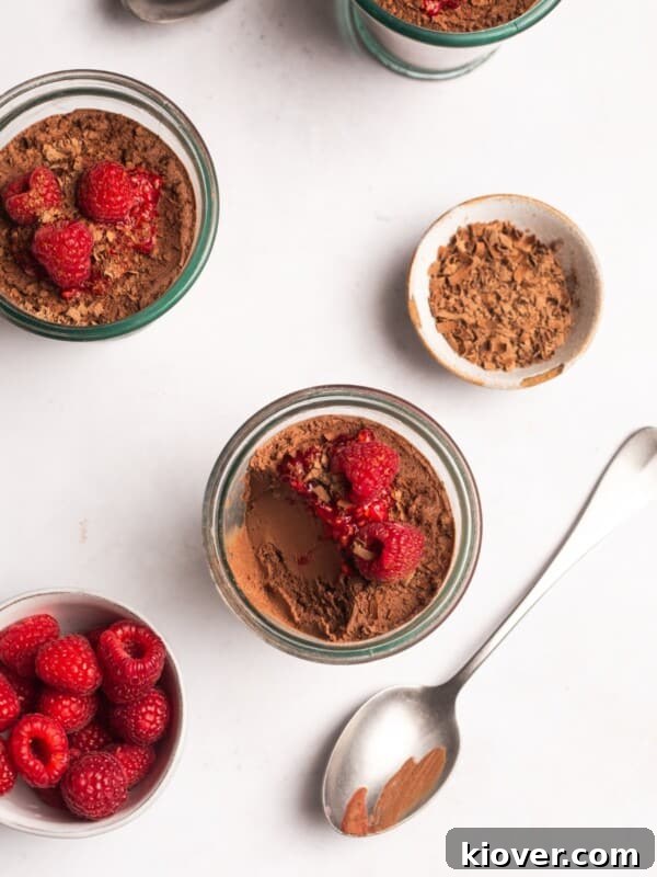 Homemade Peanut Butter Cups Recipe for Rich Chocolate Treats 12 vegan chocolate mousse with raspberries on top.