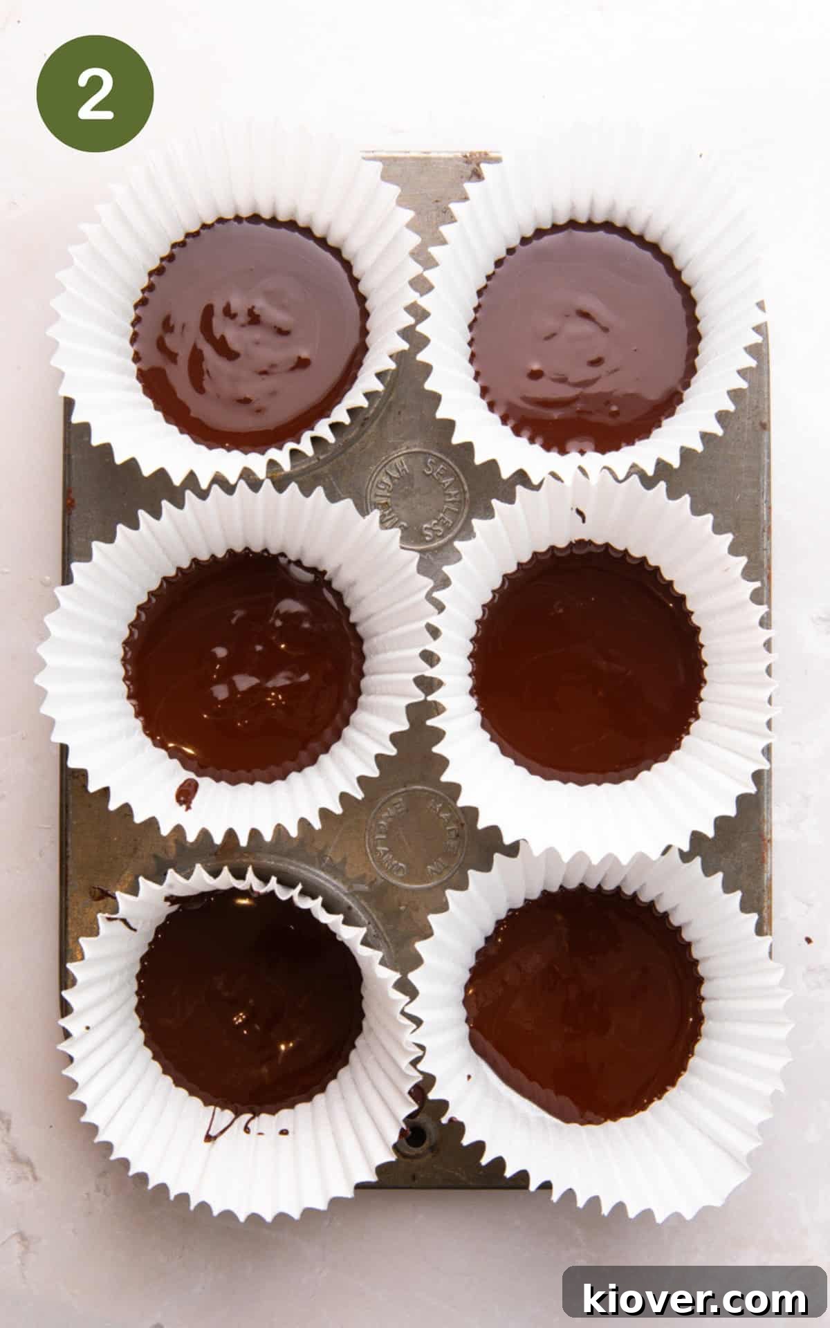 Homemade Peanut Butter Cups Recipe for Rich Chocolate Treats 5 melted chocolate in cupcake liners.