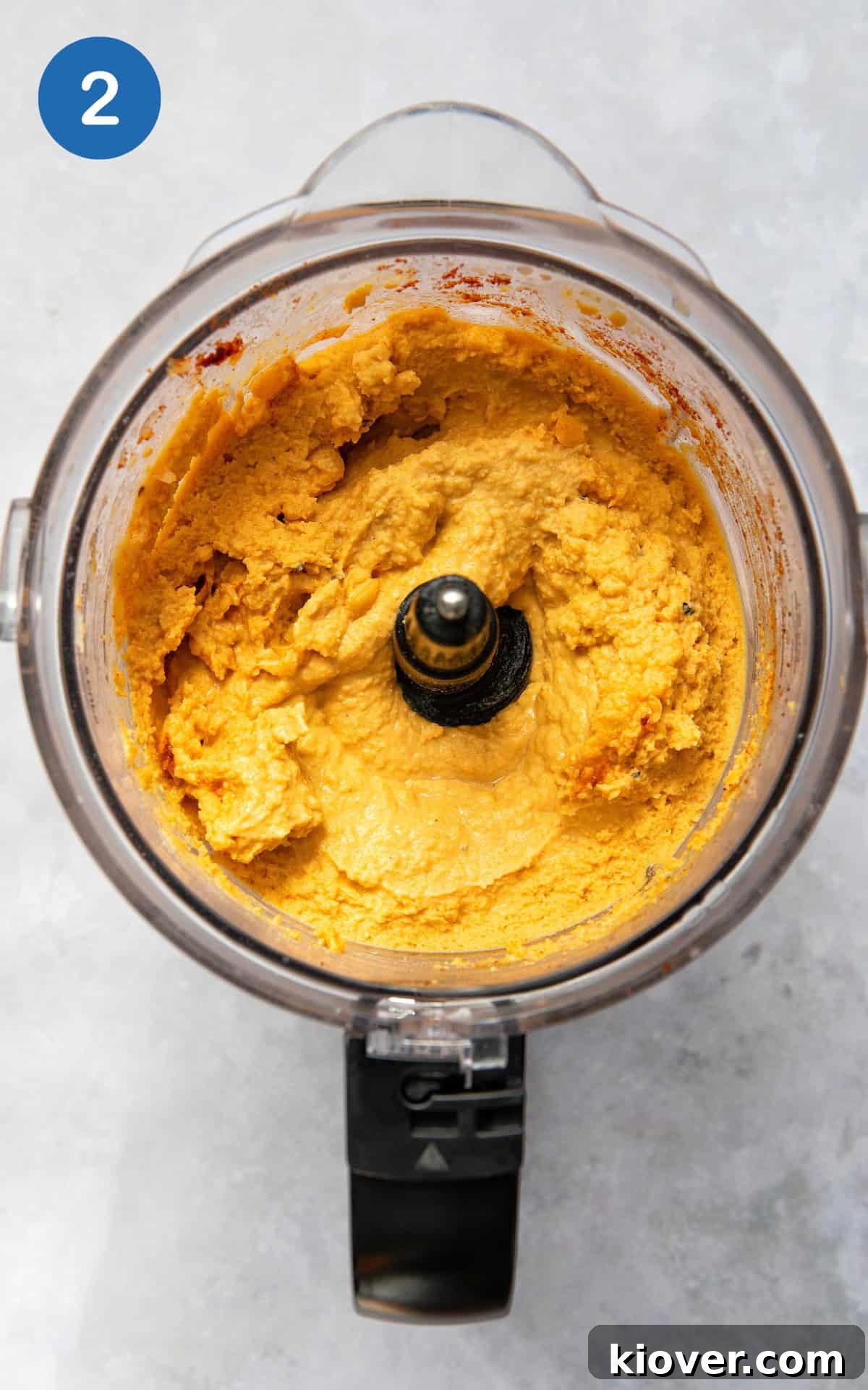 Creamy Garlic Hummus Recipe for Smooth, Flavorful Dip 5 blended chickpeas, paprika, lemon juice, olive oil and garlic in a food processor.