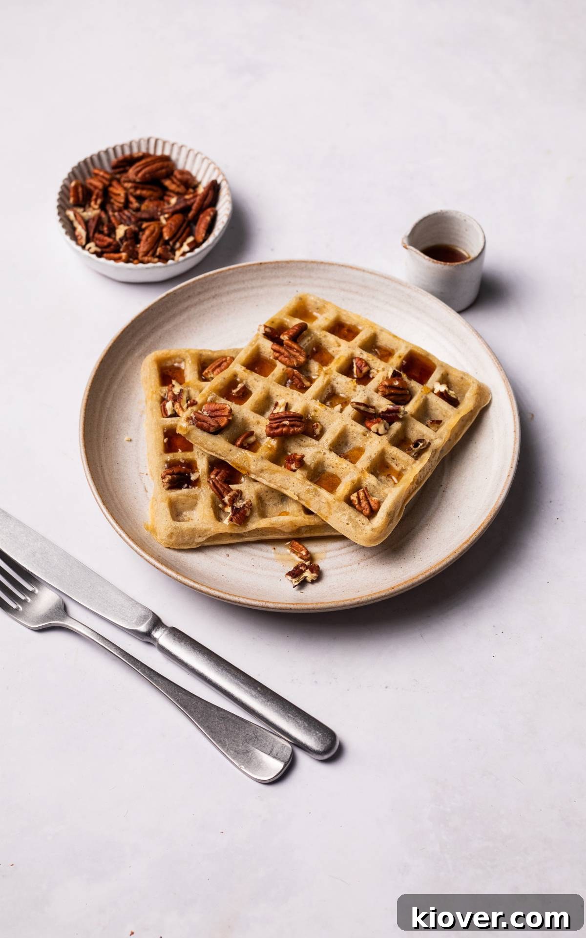 gluten free and vegan waffles with maple syrup.