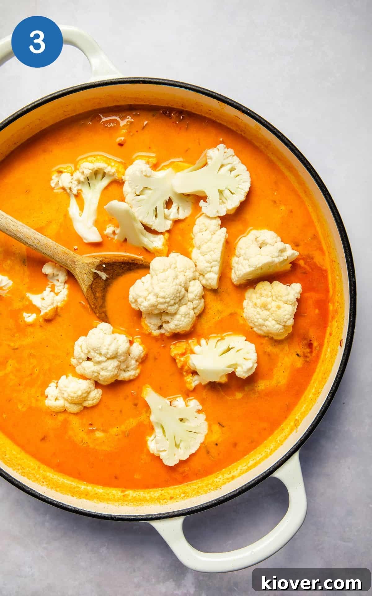 Coconut Cod Curry with Aromatic Spices 4 Coconut milk, cauliflower and spices mixed in a pot.