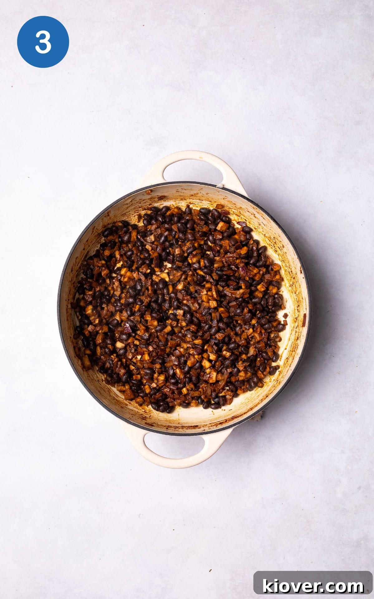Juicy Portobello Mushroom Burger Recipe for Grill or Skillet 6 adding black beans, smoked paprika, ground cumin, tamari, and salt to the pan.