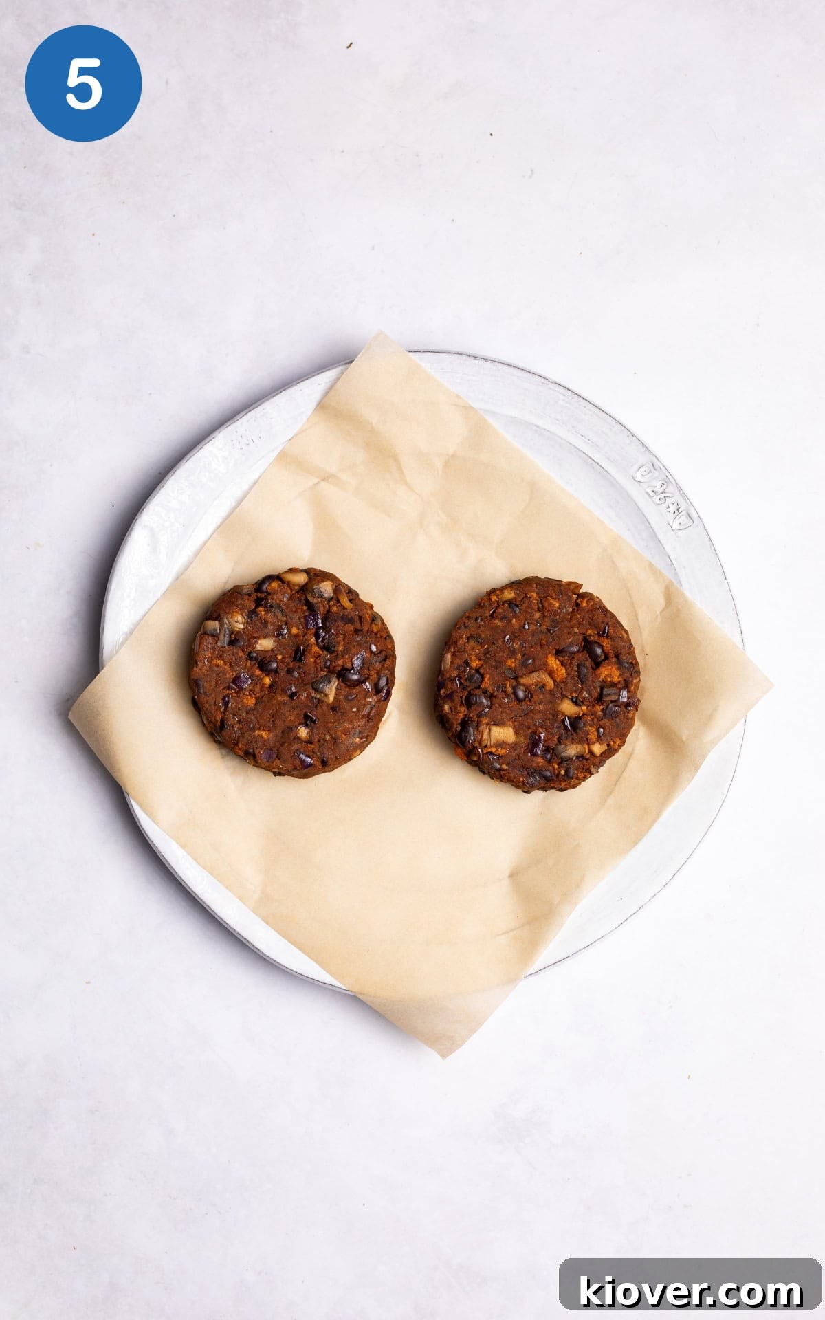 Juicy Portobello Mushroom Burger Recipe for Grill or Skillet 8 two burger patties on a baking sheet.