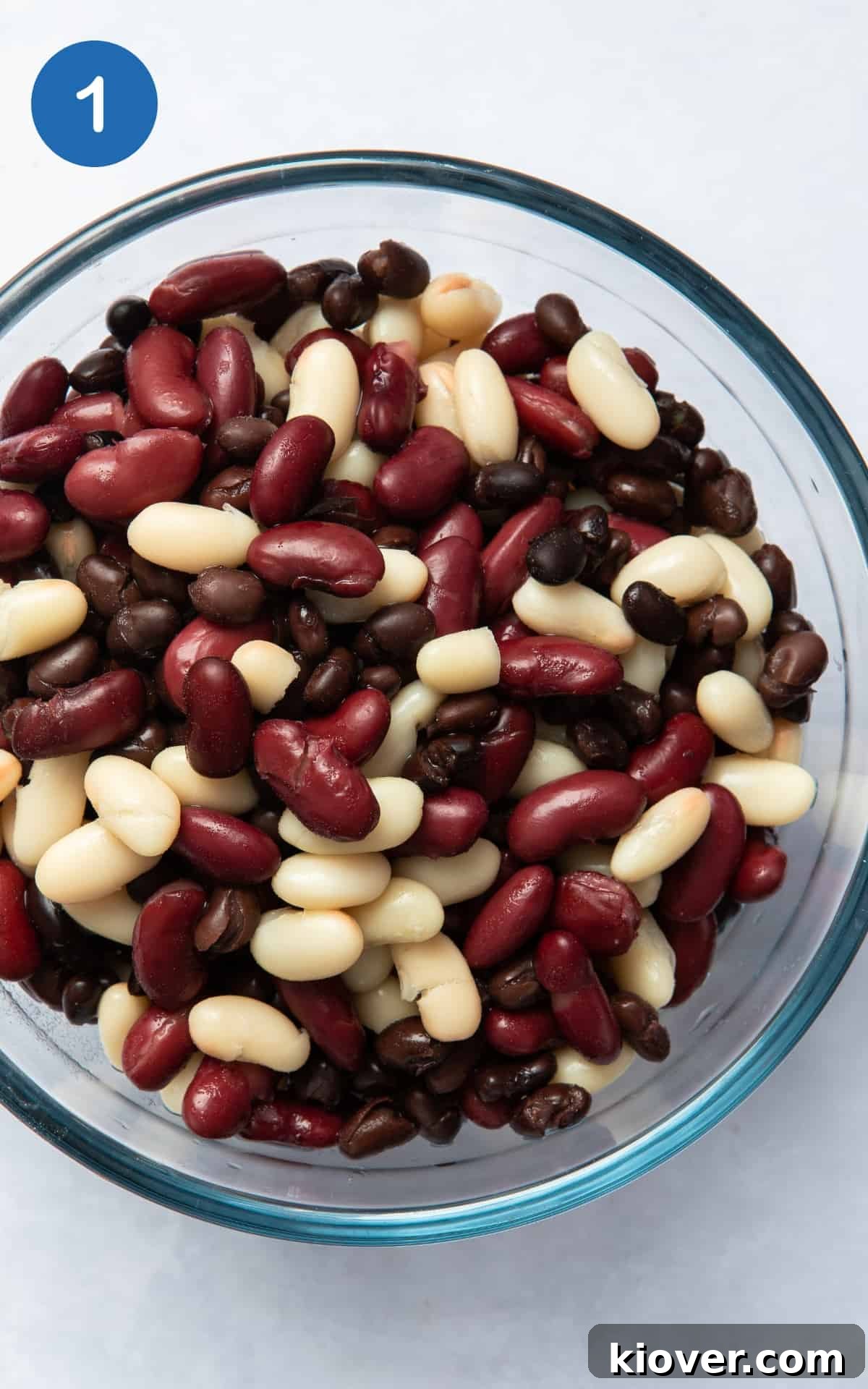drained mixed beans in a glass bowl.