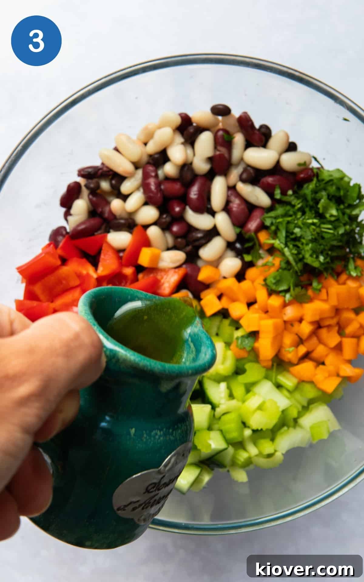 salad dressing ingredients poured onto the beans.