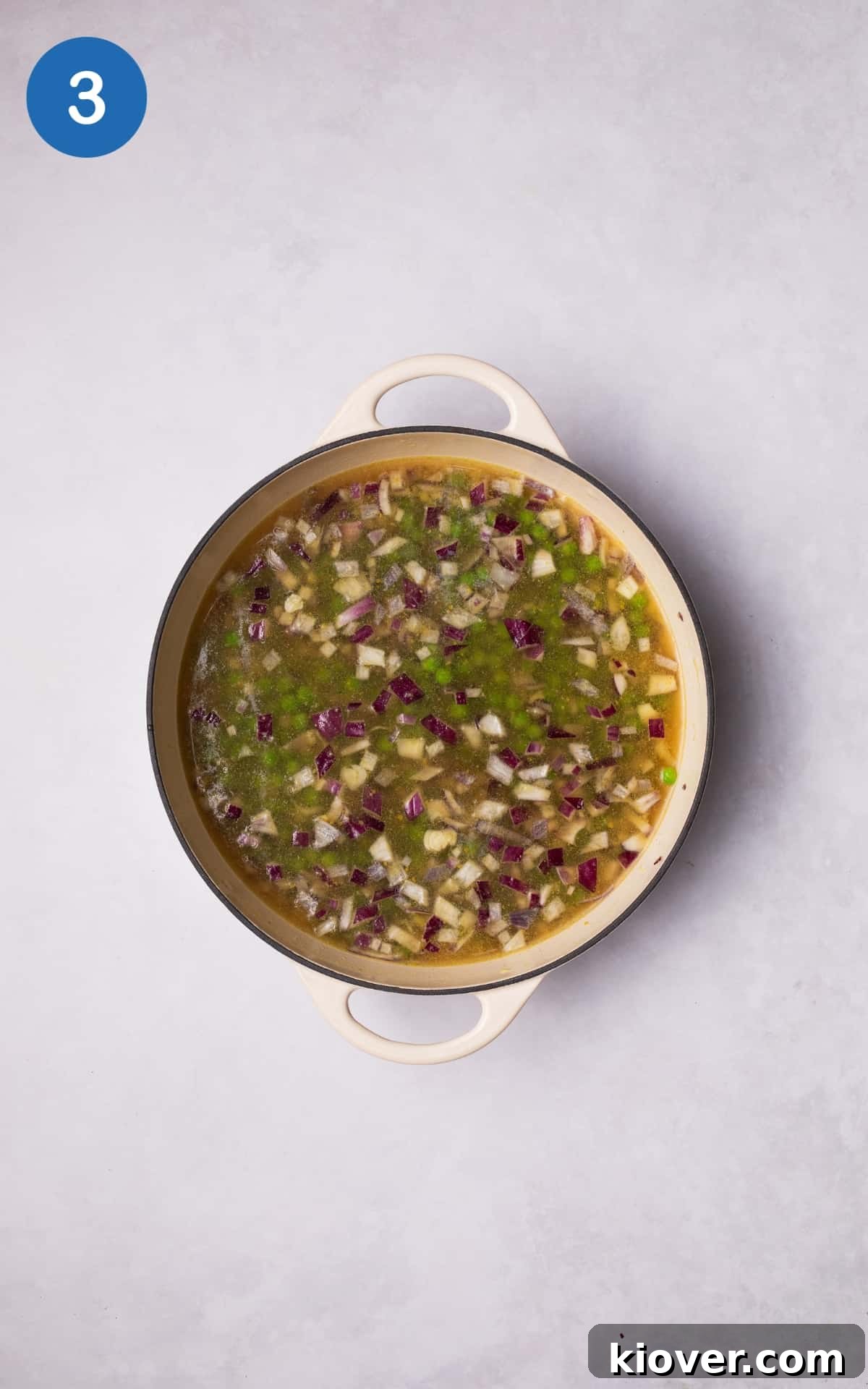 Classic Creamy Split Pea Soup Recipe for Cozy Meals 6 Adding frozen peas and vegetable stock to the pot.