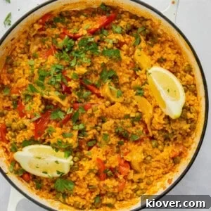 Vegetarian Paella Recipe: Flavorful Spanish Rice with Veggies 7 overhead shot of paella in large white pan