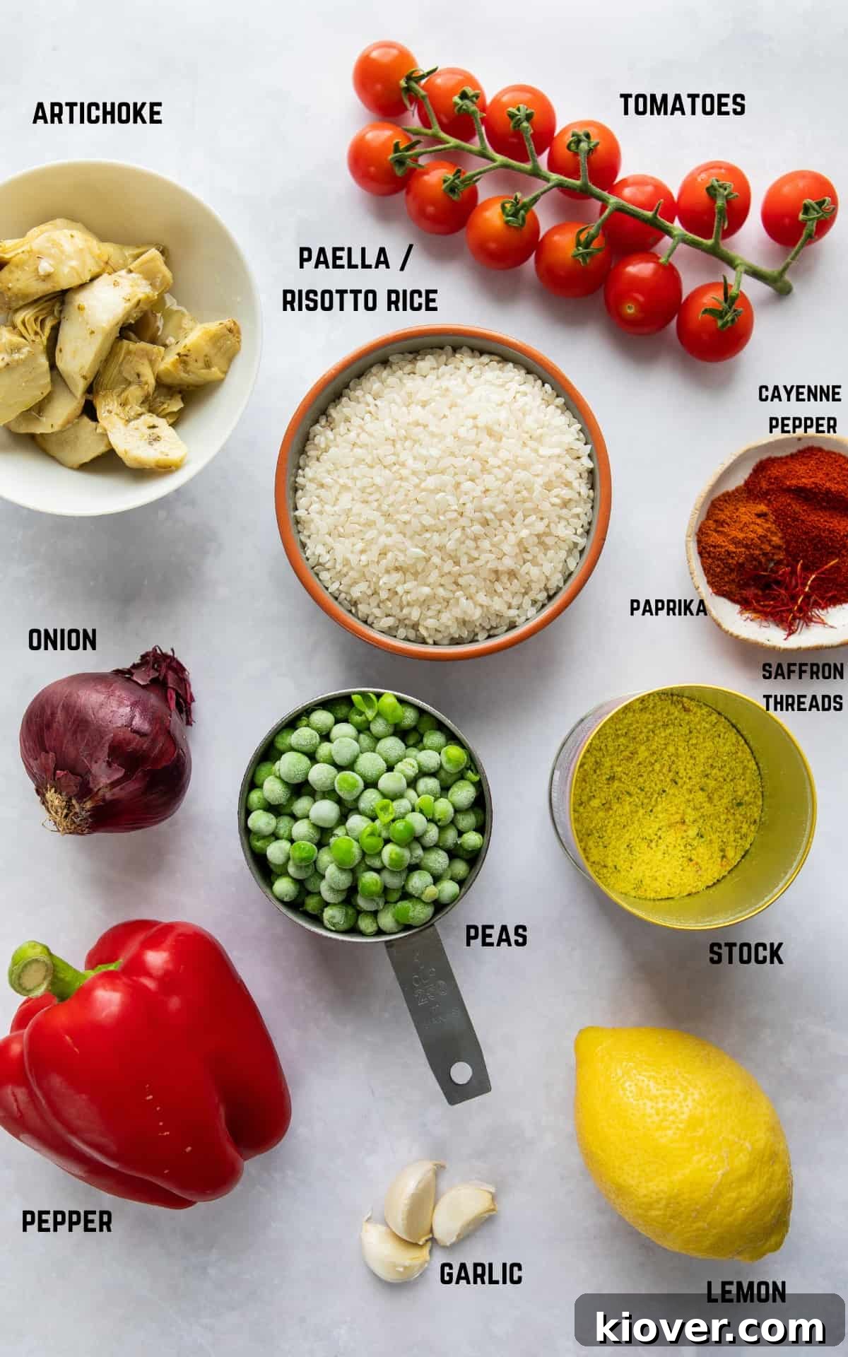 Vegetarian Paella Recipe: Flavorful Spanish Rice with Veggies 3 ingredients to make paella on white surface.