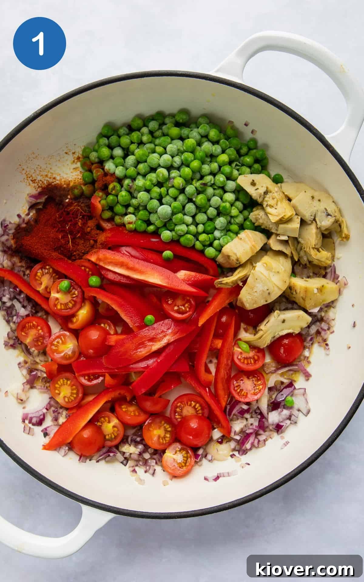 Vegetarian Paella Recipe: Flavorful Spanish Rice with Veggies 4 ingredients to make paella in large shallow white frying pan.