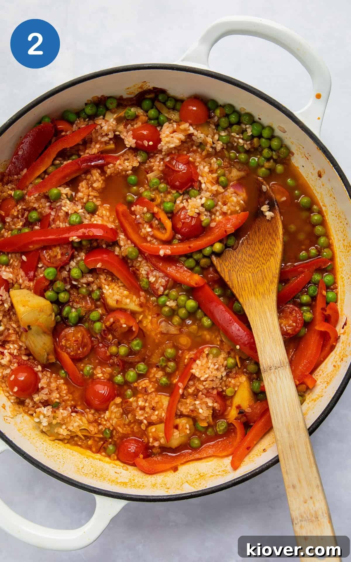 Vegetarian Paella Recipe: Flavorful Spanish Rice with Veggies 5 ingredients to make paella in large shallow white frying pan.