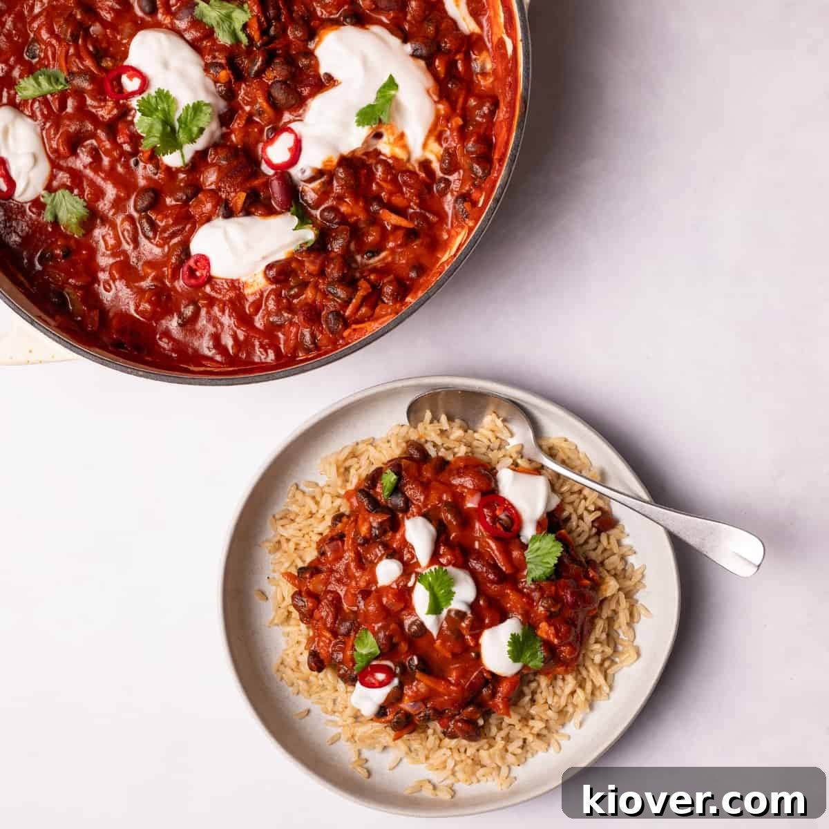 Hearty Vegan Chili Recipe with Beans and Smoky Spices 2 Vegan Chili served on a plate with brown rice.