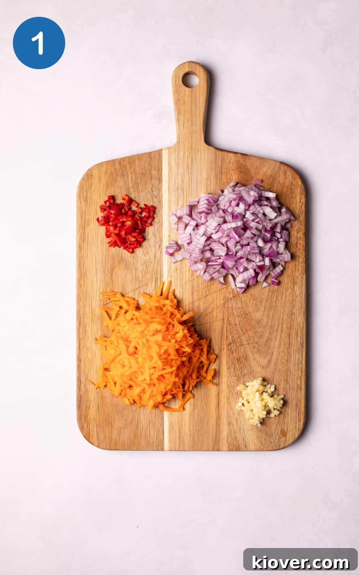 Hearty Vegan Chili Recipe with Beans and Smoky Spices 4 Vegetables on a cutting board.