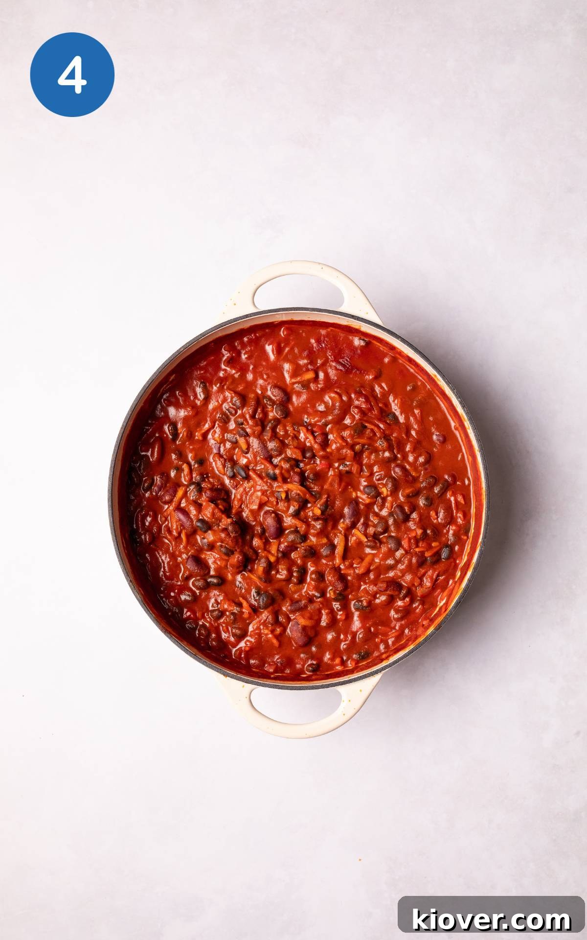 Hearty Vegan Chili Recipe with Beans and Smoky Spices 7 Cooking Vegan Chili in a pot.