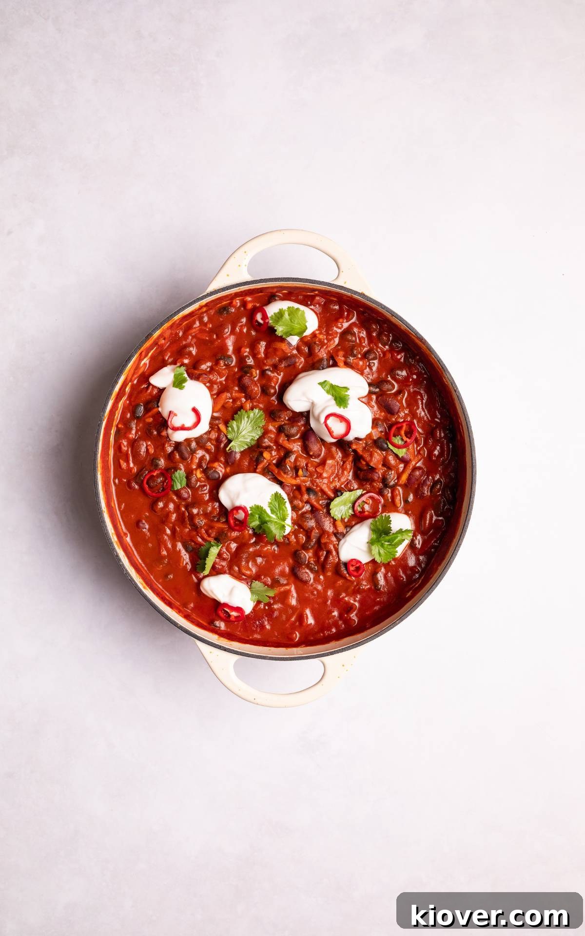 Hearty Vegan Chili Recipe with Beans and Smoky Spices 8 Vegan Chili in a dish topped with plain yoghurt.