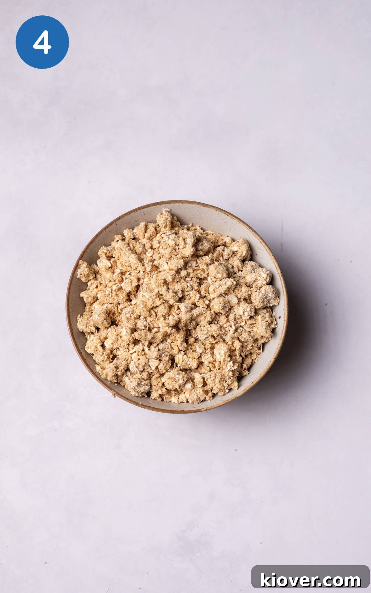 oat flour combined with butter and maple syrup in a bowl.