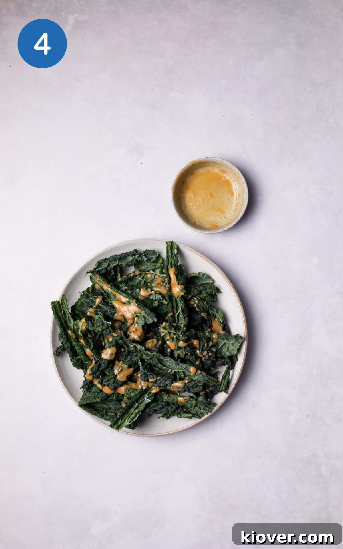 Cavolo Nero mixed with the sauce in a bowl.
