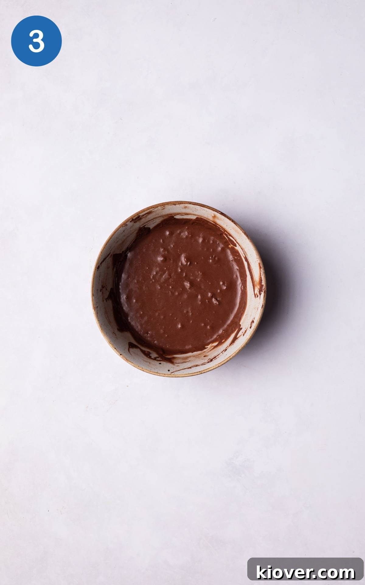 Decadent Chocolate Pots Recipe: Silky Individual Desserts 6 Adding wet ingredients to the mixture.