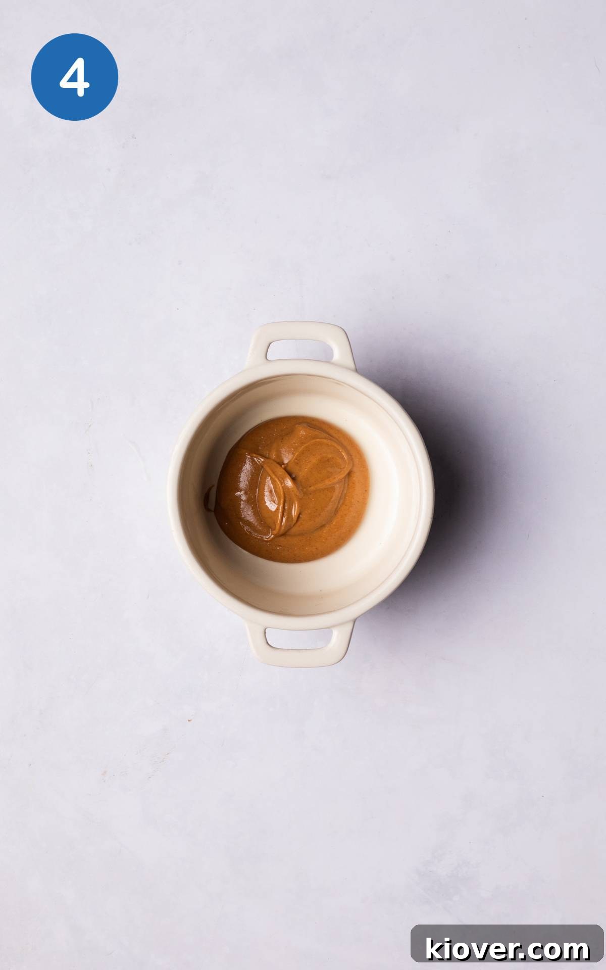 Decadent Chocolate Pots Recipe: Silky Individual Desserts 7 spoonful of peanut butter at the bottom of a ramekin.