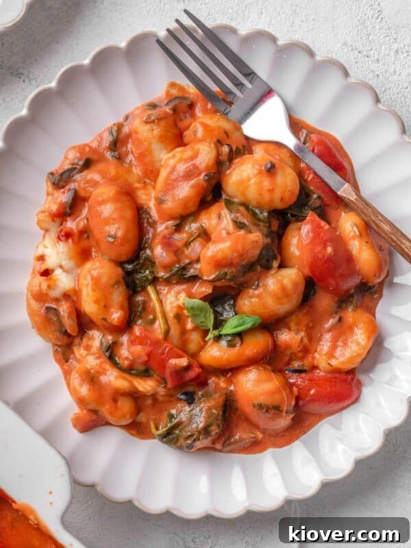 Creamy Sausage Gnocchi with Spinach and Parmesan 11 Baked gnocchi served on a plate.