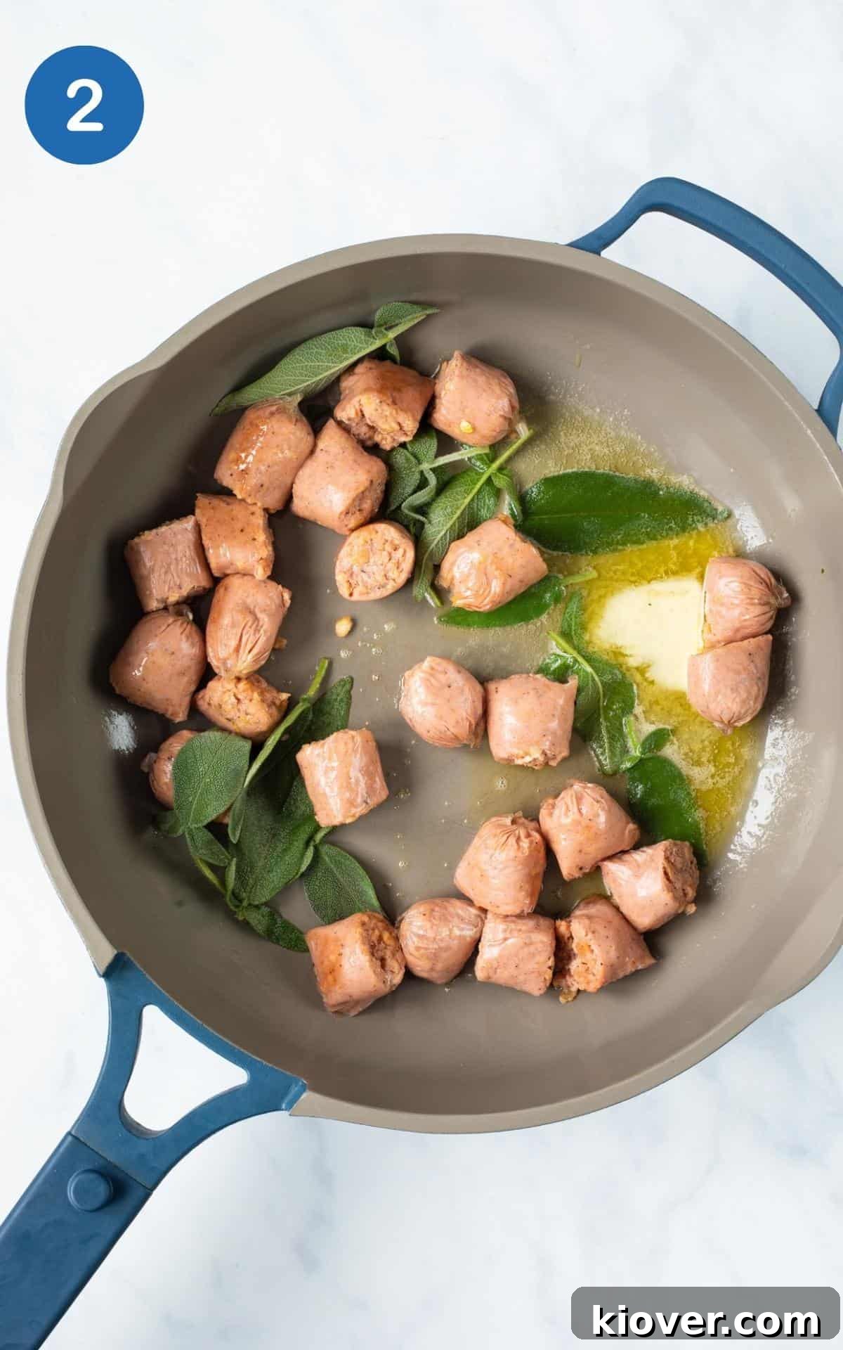 Creamy Sausage Gnocchi with Spinach and Parmesan 5 blue frying pan with sausages, butter, sage.