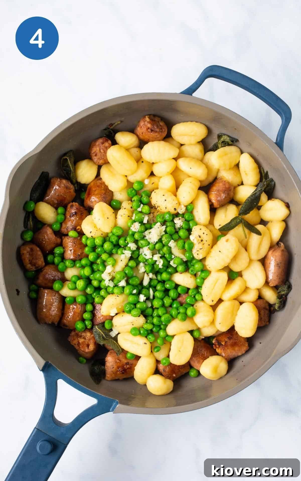 Creamy Sausage Gnocchi with Spinach and Parmesan 7 blue pan with all the ingredients to fry.
