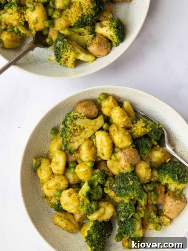 Creamy Sausage Gnocchi with Spinach and Parmesan 10 2 bowls of Sausage Gnocchi Pasta ready to eat.
