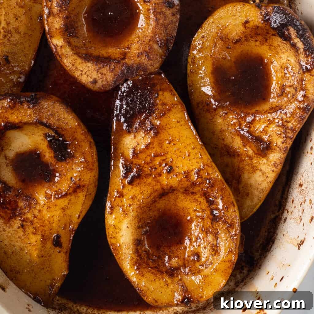 Baked Pears with Honey and Cinnamon — Simple Warm Dessert 2 a closeup view of these delicious baked spiced pears coated in a rich sauce.