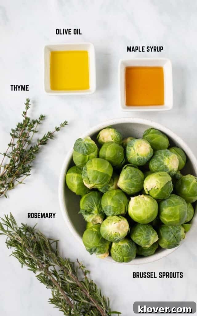 Crispy Smashed Brussels Sprouts with Garlic and Parmesan 3 top view of labeled ingredients including olive oil, maple syrup, thyme, rosemary, brussels sprouts on white marble.