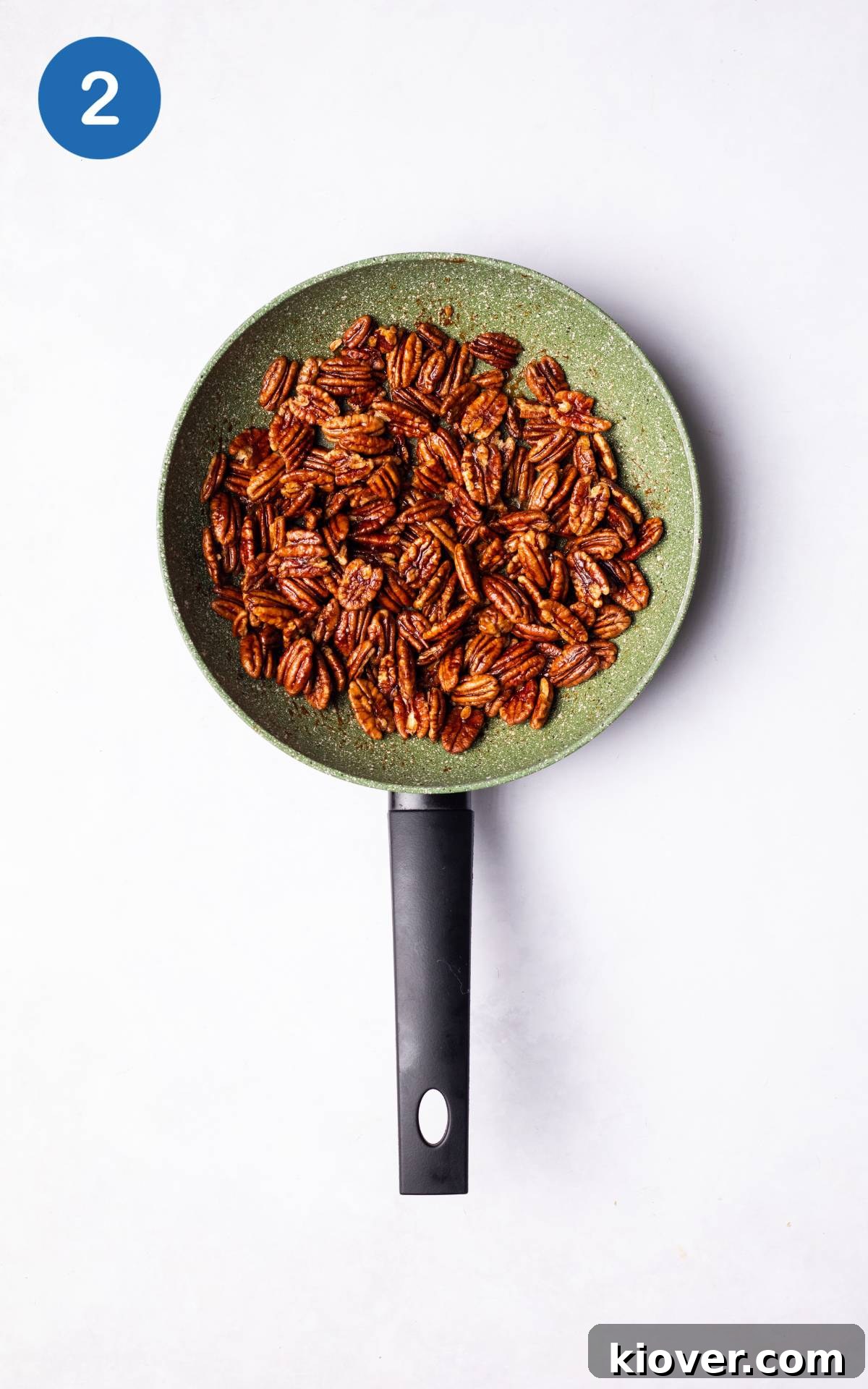 Sweet Cinnamon Candied Pecans Recipe for Gift Giving 5 Frying pecans in a pan.