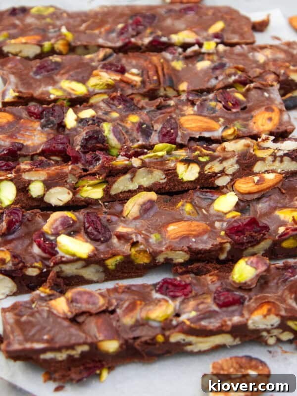 Vegan rocky road in slices on parchment paper.