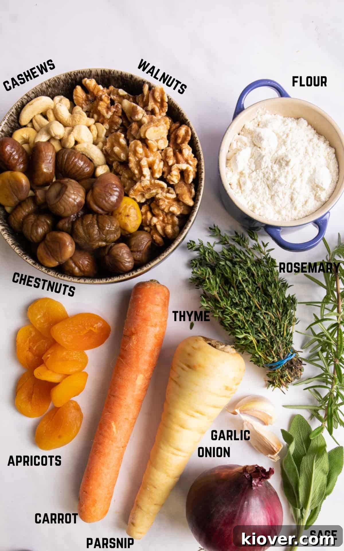 ingredients to make nut roast displayed on white background.