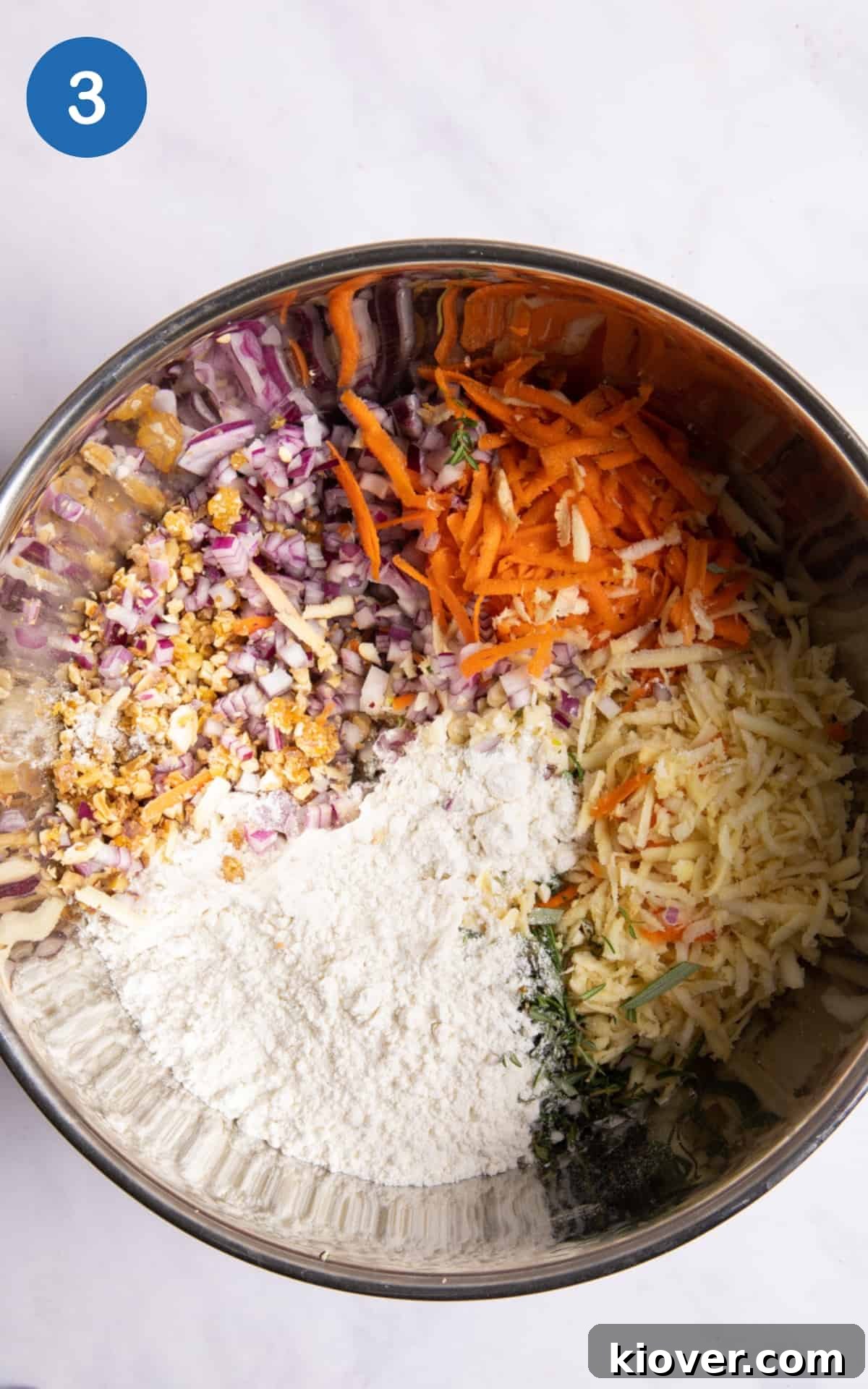 Ingredients in a large silver mixing bowl before mixing.