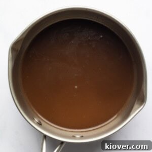 Creamy Mushroom Gravy Recipe for Roast and Mashed Potatoes 13 mushroom gravy served in a metal pot.