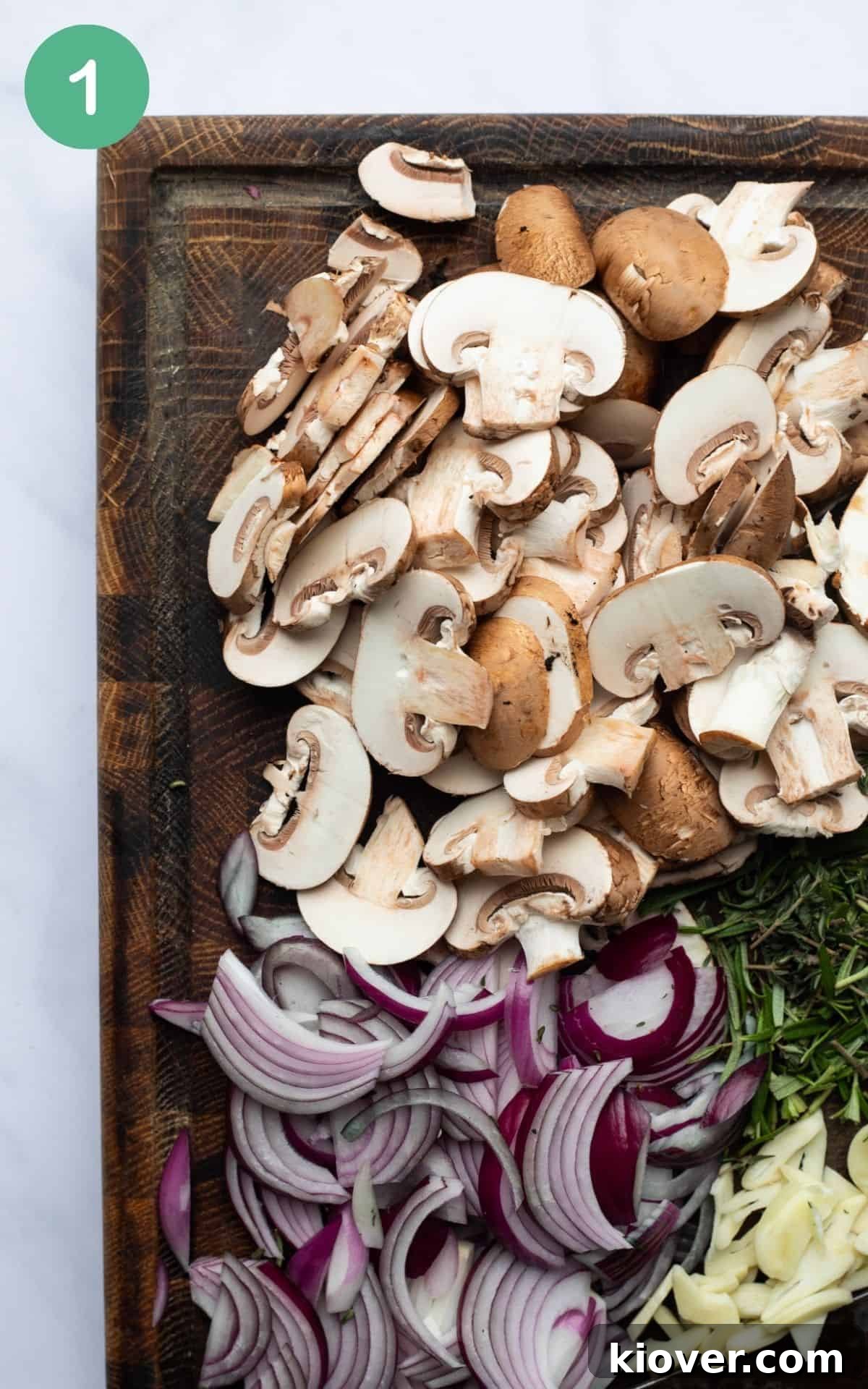 Creamy Mushroom Gravy Recipe for Roast and Mashed Potatoes 4 chopped mushrooms, onion and herbs on a chopping board