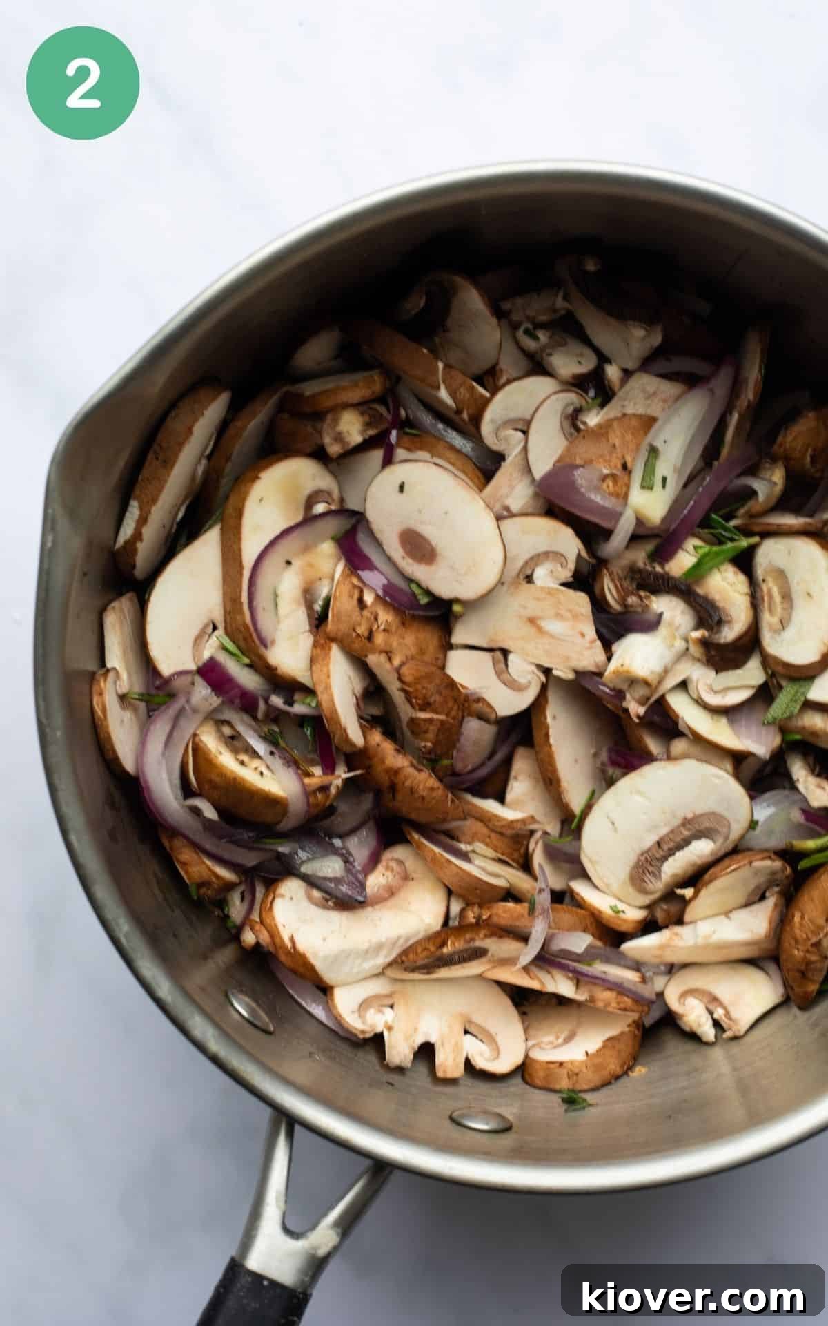 Creamy Mushroom Gravy Recipe for Roast and Mashed Potatoes 5 fried mushrooms, onion, herbs in a silver pot