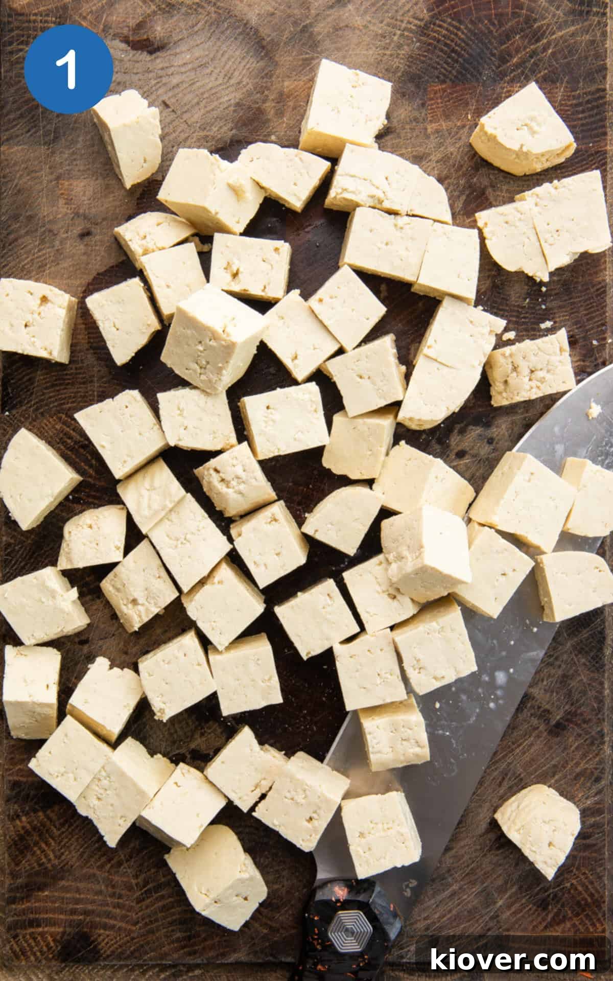 tofu cubes on a cutting board.