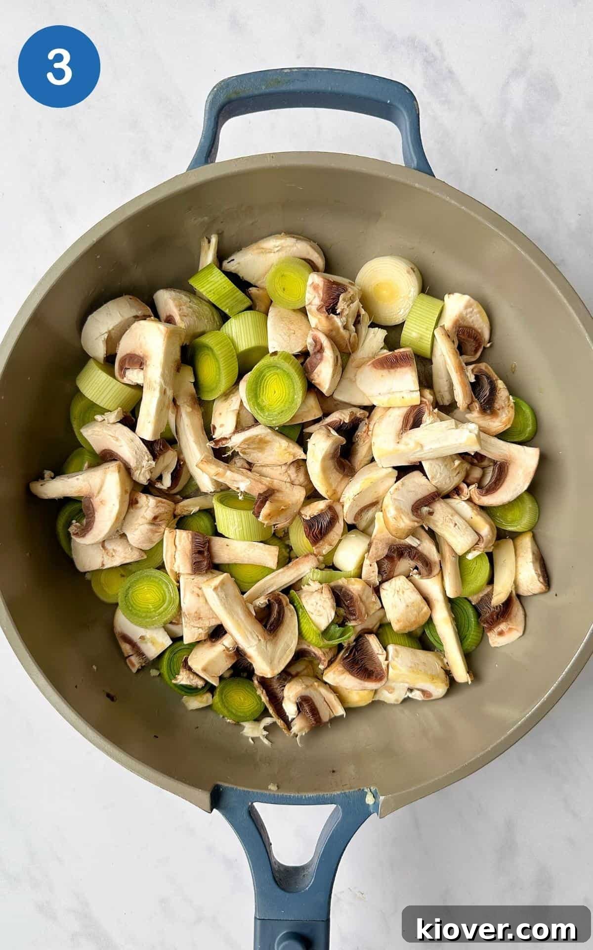 Savory Vegan Mushroom Pie Recipe with Flaky Crust 6 Chopped leeks and mushrooms frying in a non-stick frying pan.