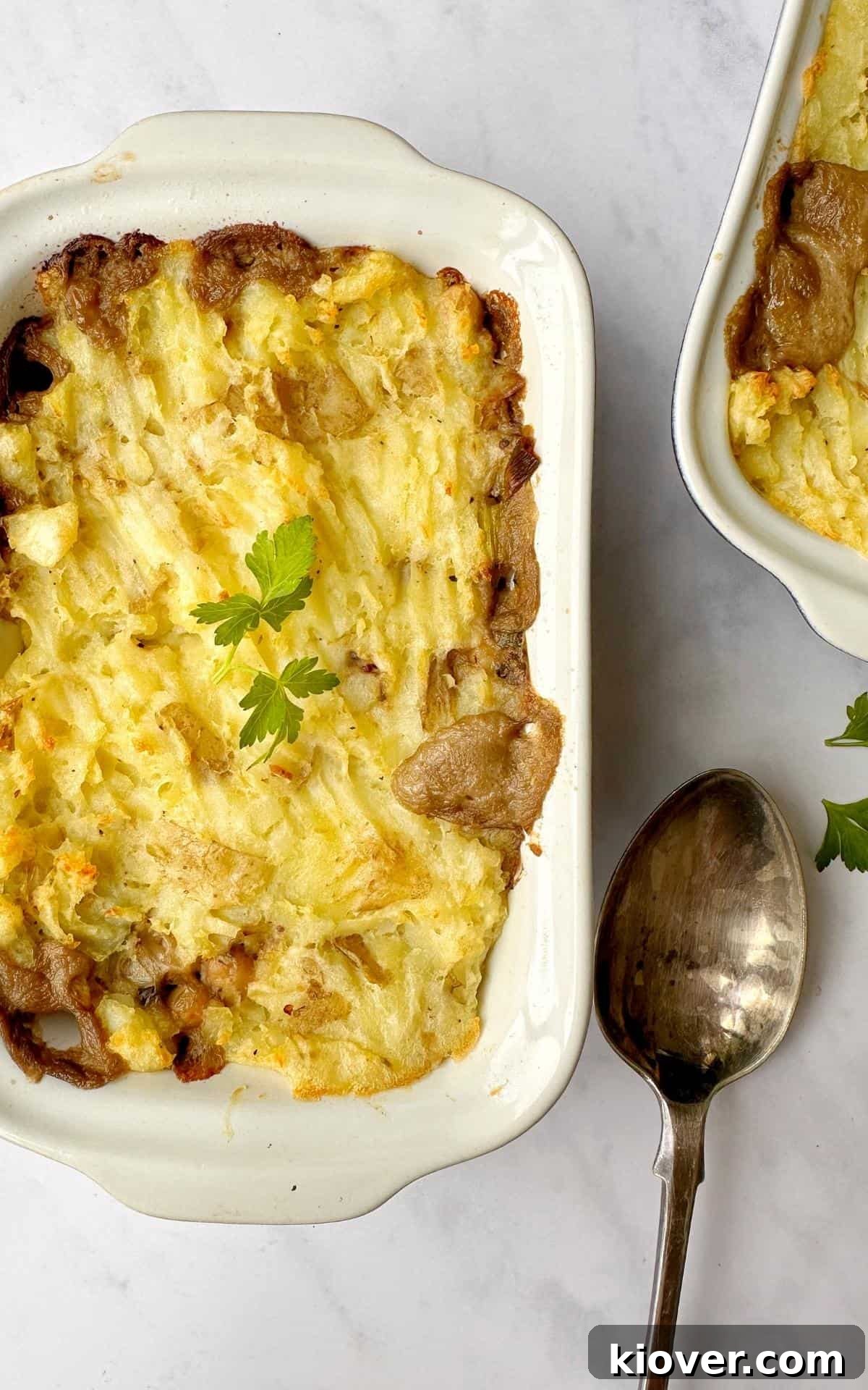 Savory Vegan Mushroom Pie Recipe with Flaky Crust 10 Vegan Mushroom Pie in a baking dish with a silver serving spoon.