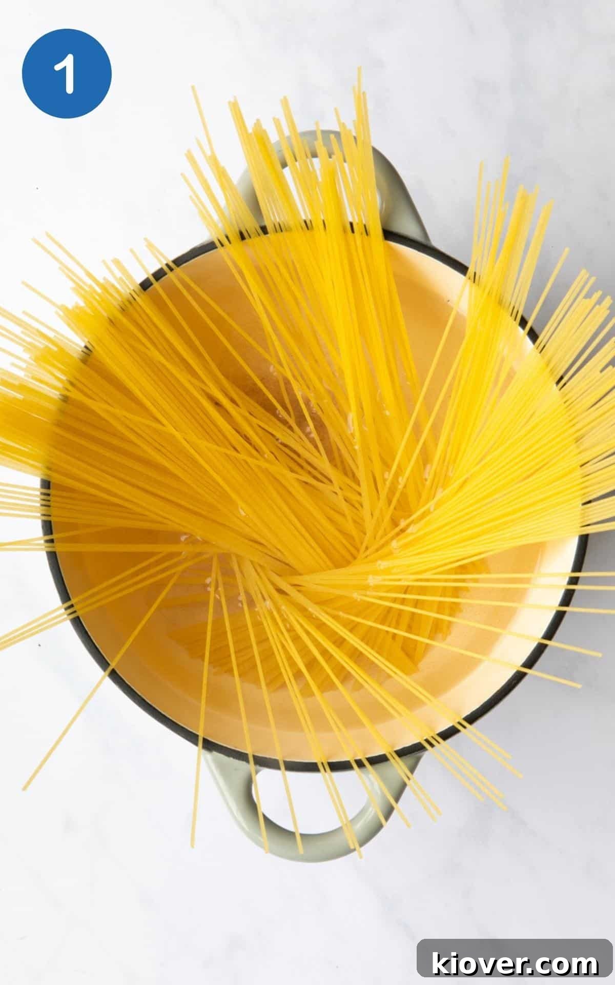 Creamy Vegan Mushroom Pasta Recipe for Dinner Nights 4 Spaghetti being added to boiling water.