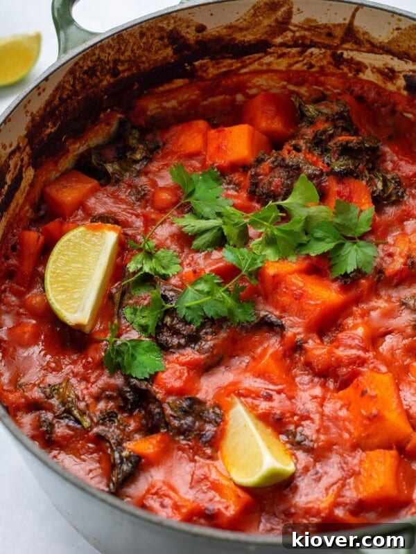 sweet potato and chickpea curry served in a large green pot.