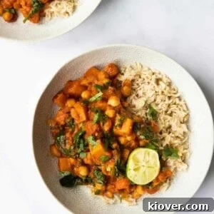 Butternut Squash and Chickpea curry in a bowl with lime