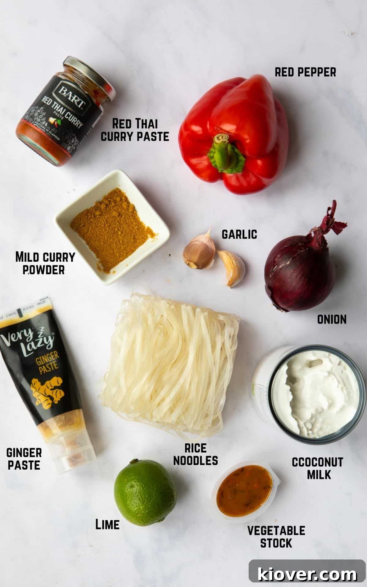 Thai Curry Noodle Soup Recipe — Creamy Thai Coconut Noodle Bowl 3 Ingredients to make Thai Curry Noodle Soup displayed on a white marble background.
